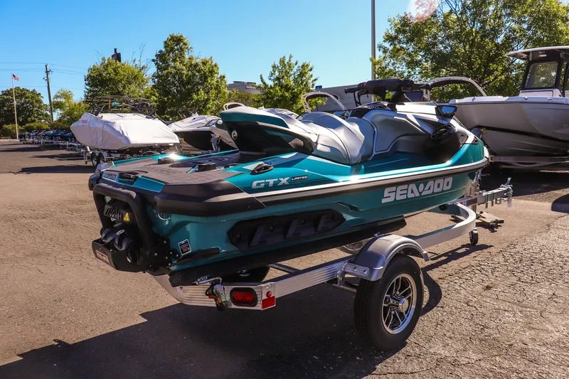 Slide: The Image of 2026 Sea-Doo GTX Limited 325 on trailer, parked outdoors in a marina setting. - 3