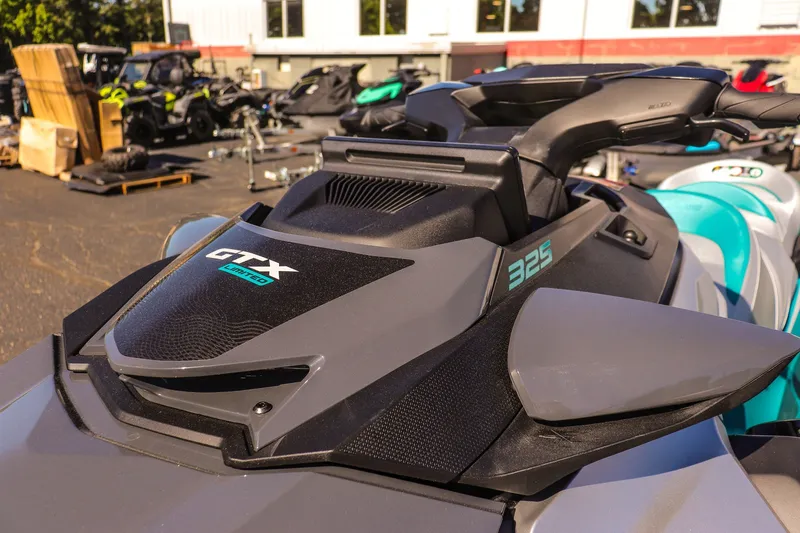 Slide: The Image of 2026 Sea-Doo GTX Limited 325 jet ski, close-up view of handlebars and design. - 16