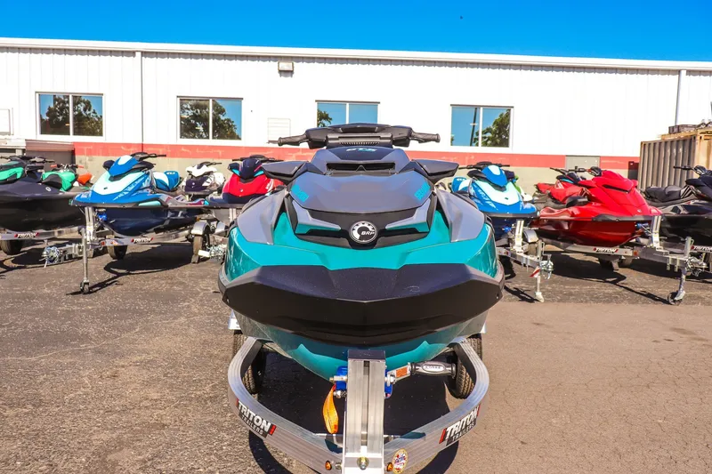 Slide: The Image of 2026 Sea-Doo GTX Limited 325 jet ski displayed outdoors with other models. - 8