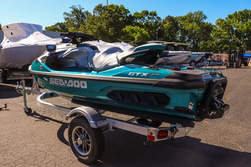 Slide: The Image of 2026 Sea-Doo GTX Limited 325 on trailer, parked outdoors in a sunny setting. - 5