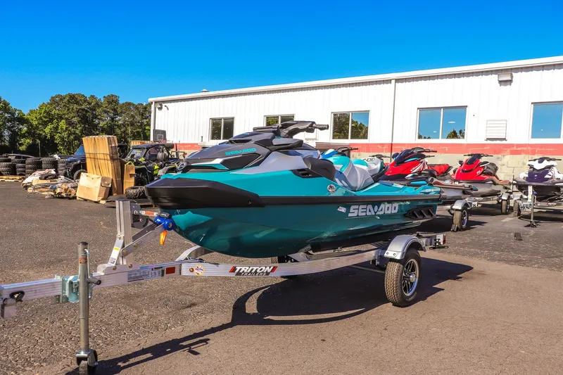 Slide: The Image of 2026 Sea-Doo GTX Limited 325 on trailer, parked outdoors near a building. - 7