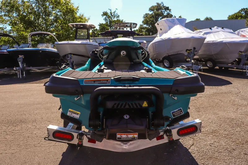 Slide: The Image of 2026 Sea-Doo GTX Limited 325 jet ski displayed outdoors, surrounded by other boats. - 4