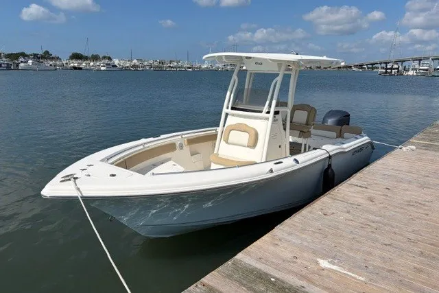 Slide: The Image of 2019 Key West 239 FS boat docked at marina under clear blue sky. - 3