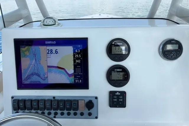 Slide: The Image of Dashboard of 2019 Key West 239 FS boat with navigation and control instruments. - 21