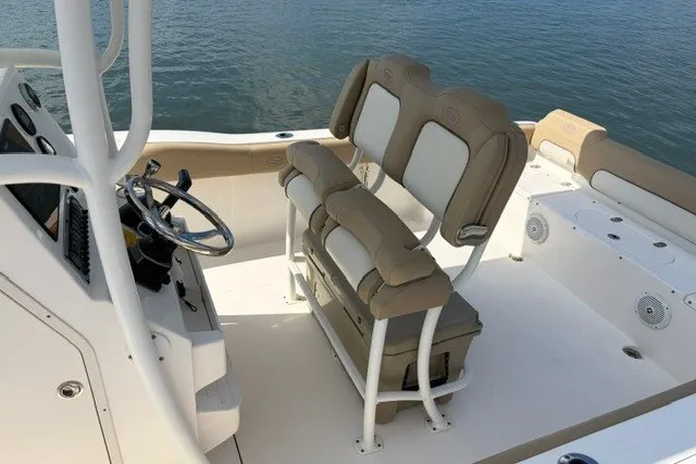 Slide: The Image of 2019 Key West 239 FS boat interior with dual seats and steering wheel. - 5