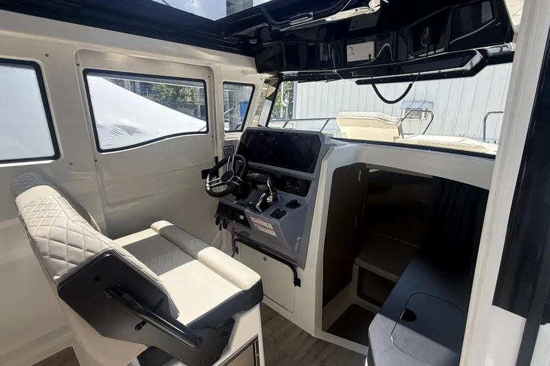 Slide: The Image of Interior of 2026 Navan C30 boat with modern helm and seating. - 19