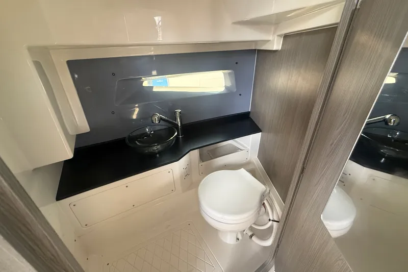 Slide: The Image of Modern bathroom interior in 2026 Navan C30 boat, featuring sleek sink and compact toilet. - 31