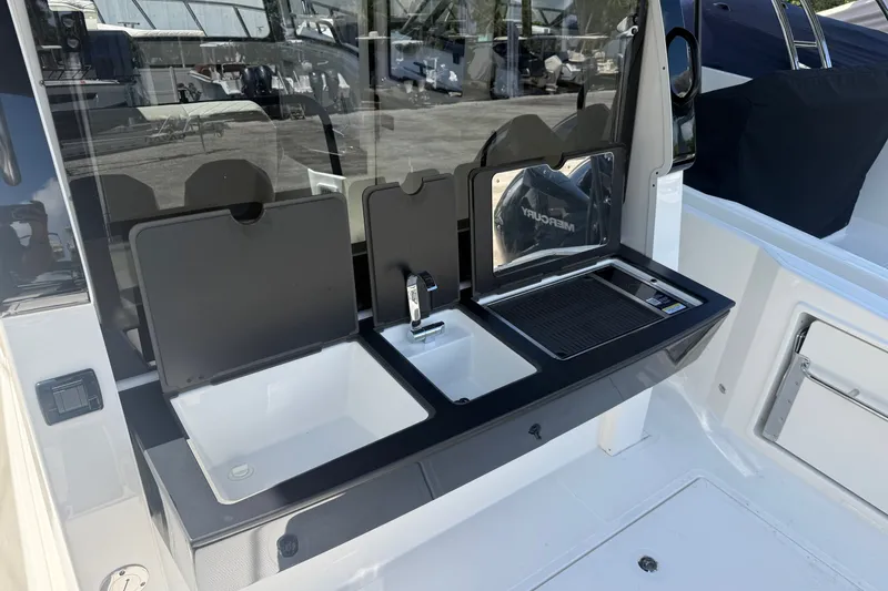Slide: The Image of Outdoor kitchen setup on 2026 Navan C30 boat with sink and grill. - 15