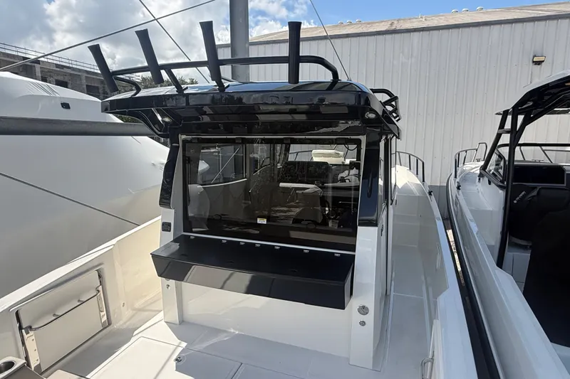 Slide: The Image of 2026 Navan C30 boat with sleek design, featuring a modern cockpit and spacious deck area. - 11