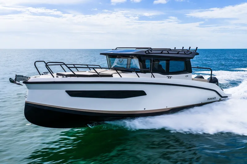 Slide: The Image of 2026 Navan C30 boat cruising on open sea under clear sky. - 6