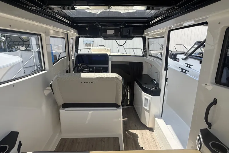 Slide: The Image of Interior of 2026 Navan C30 boat, featuring modern seating and steering console. - 22