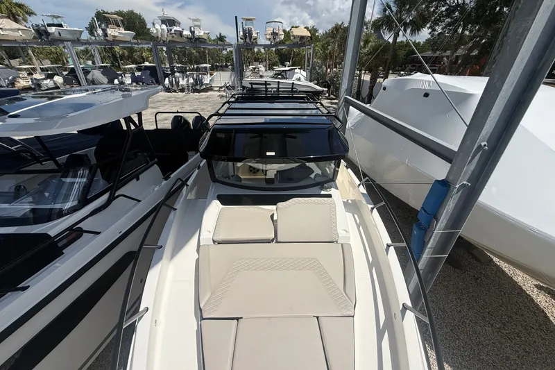 Slide: The Image of 2026 Navan C30 boat with sleek design, docked among other vessels in a marina. - 27