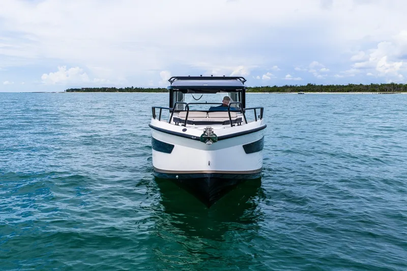 Slide: The Image of Front view of 2026 Navan C30 boat on open water under a cloudy sky. - 3