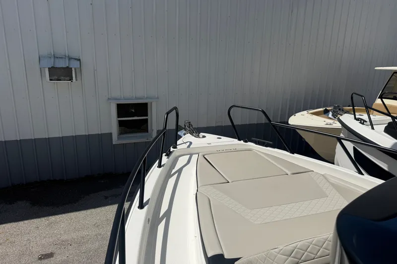 Slide: The Image of 2026 Navan C30 boat docked beside a building, showcasing sleek design and modern features. - 26