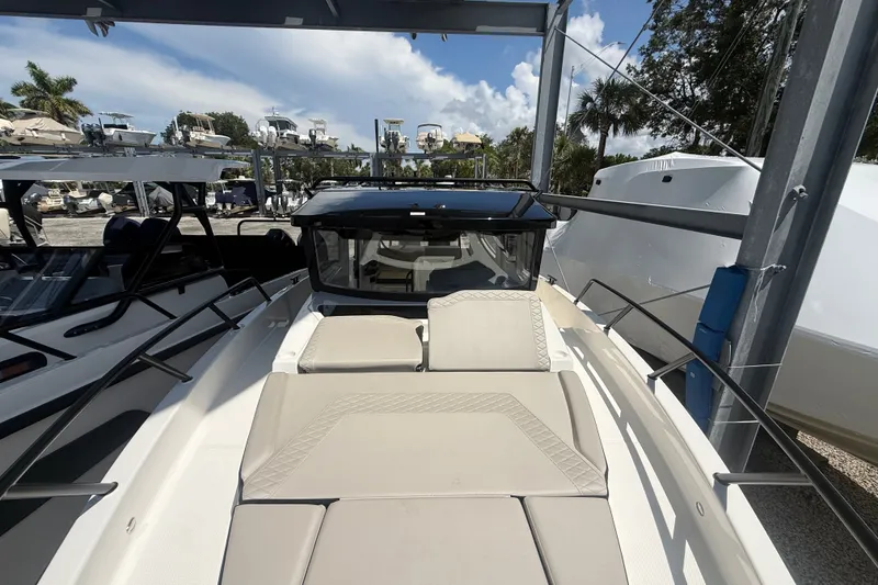 Slide: The Image of 2026 Navan C30 boat with sleek design, docked under a canopy. - 28