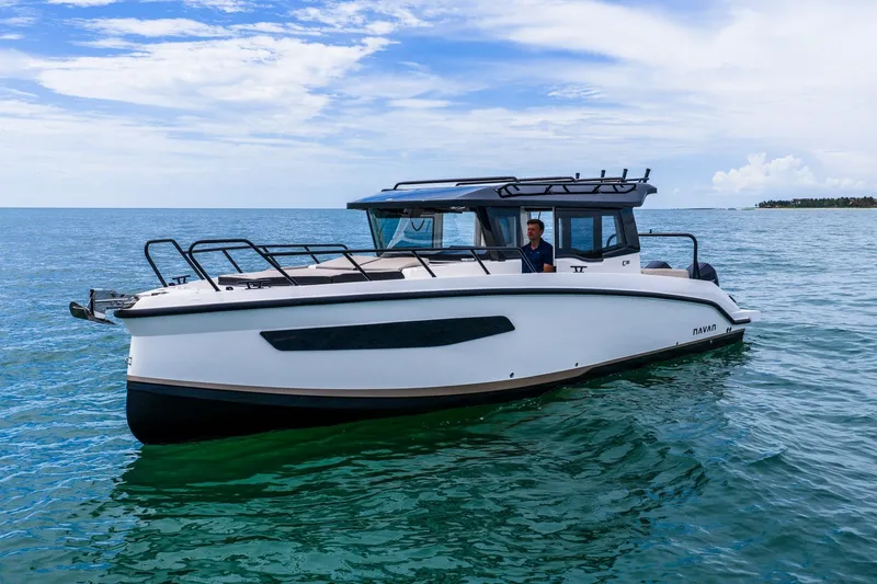 Slide: The Image of 2026 Navan C30 boat cruising on calm ocean waters under a clear sky. - 1