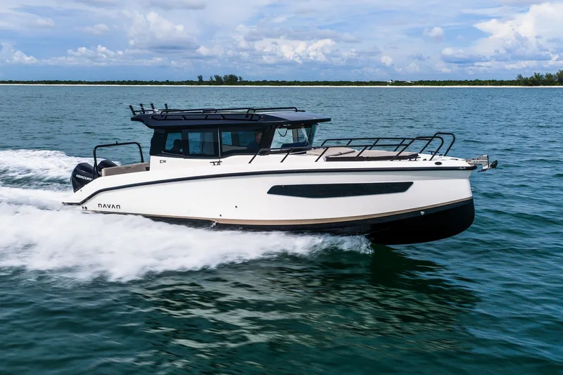 Slide: The Image of 2026 Navan C30 boat cruising on open water under a clear sky. - 10