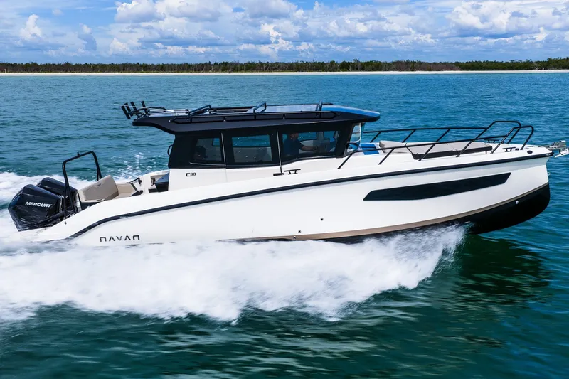 Slide: The Image of Navan C30 2026 boat cruising on blue ocean with clear sky background. - 5
