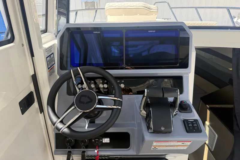 Slide: The Image of 2026 Navan C30 boat cockpit with dual Simrad displays and modern steering wheel. - 25