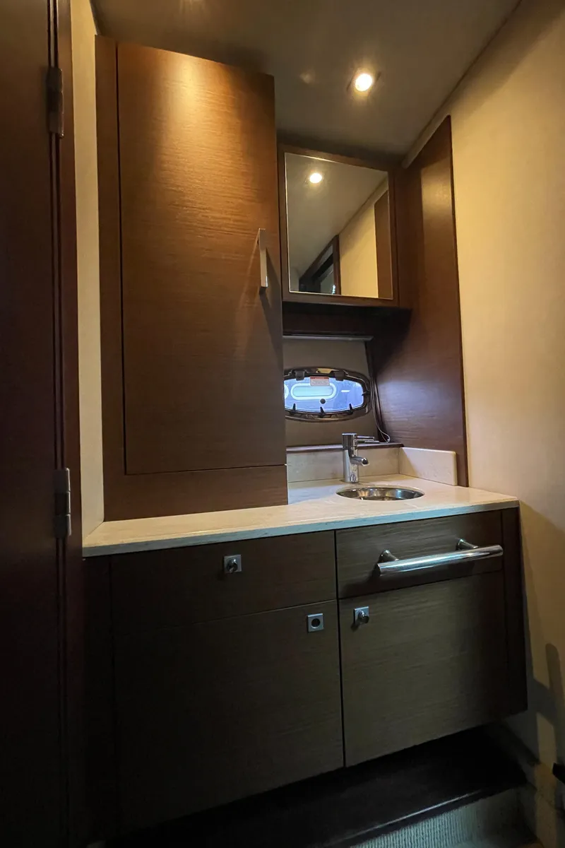 Slide: The Image of Interior of the 2012 Sea Ray 470 Sundancer with sink and cabinets. - 43