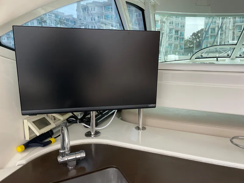 Slide: The Image of A modern monitor is mounted on a boat, surrounded by sleek white surfaces and windows. - 17