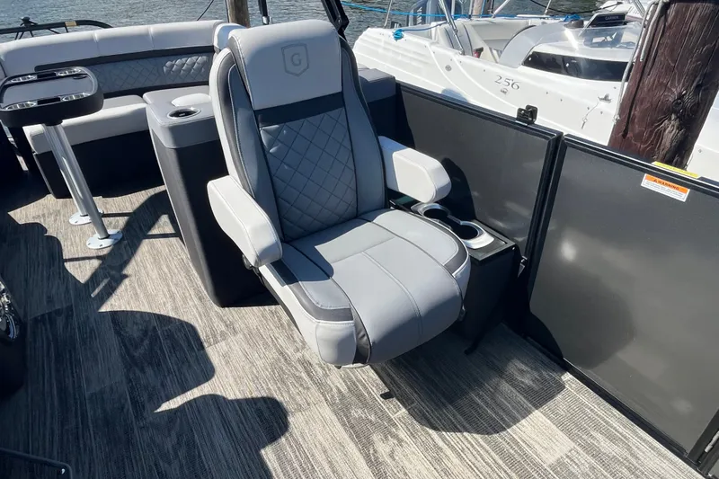 Slide: The Image of Luxury seating on 2022 Godfrey AquaPatio 235 ULC pontoon boat, featuring modern design. - 6