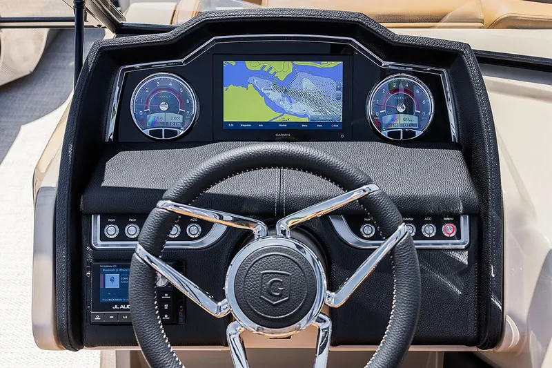 Slide: The Image of Manufacturer Provided Image: 2022 Godfrey AquaPatio 235 ULC dashboard with navigation screen and steering wheel. - 9