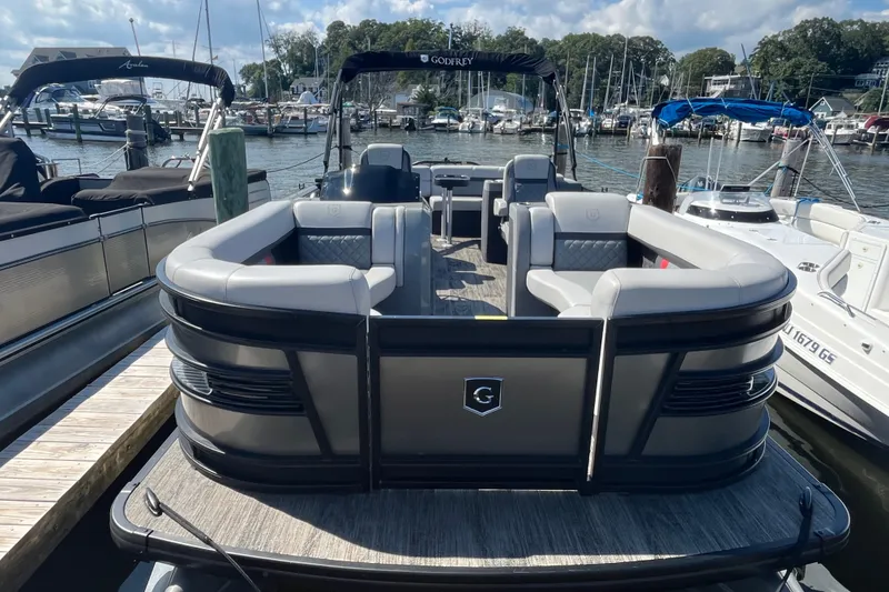 Slide: The Image of 2022 Godfrey AquaPatio 235 ULC pontoon boat docked at a marina. - 21