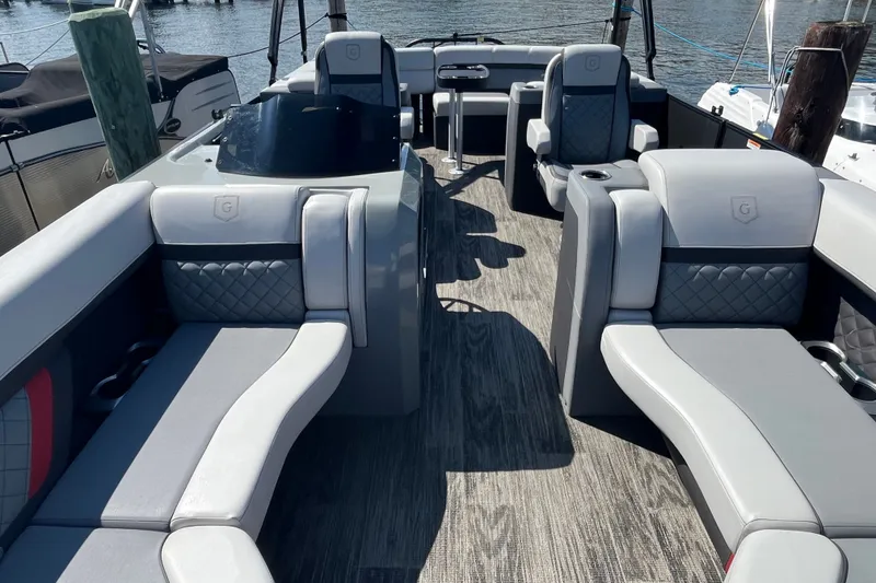 Slide: The Image of Luxurious interior of 2022 Godfrey AquaPatio 235 ULC pontoon boat with plush seating. - 3