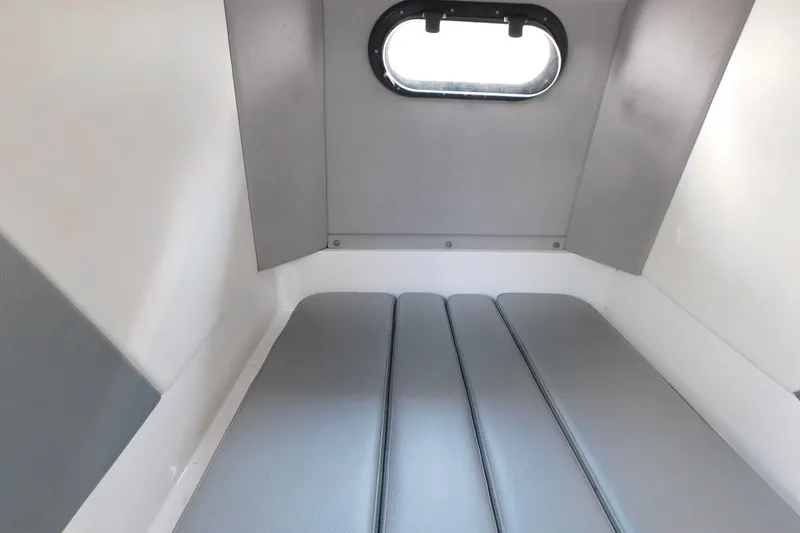 Slide: The Image of 2017 Sunsation 32 CCX cabin interior with cushioned seating and small window. - 46