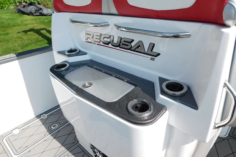 Slide: The Image of 2017 Sunsation 32 CCX boat interior with cup holders and sleek design. - 13