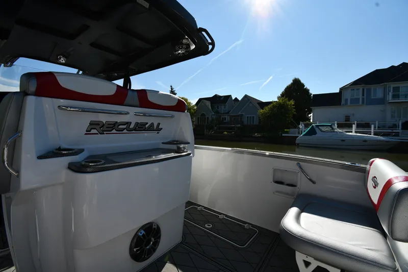 Slide: The Image of 2017 Sunsation 32 CCX boat interior with seating and waterfront view. - 15