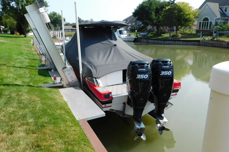 Slide: The Image of 2017 Sunsation 32 CCX boat with twin 350 Verado engines docked in a canal. - 54
