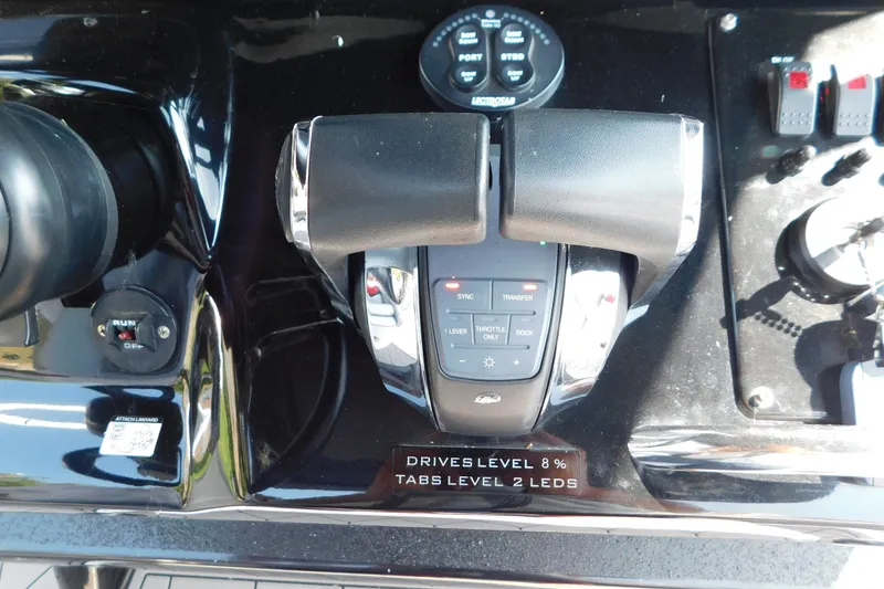 Slide: The Image of 2017 Sunsation 32 CCX boat controls with throttle and switches. - 35