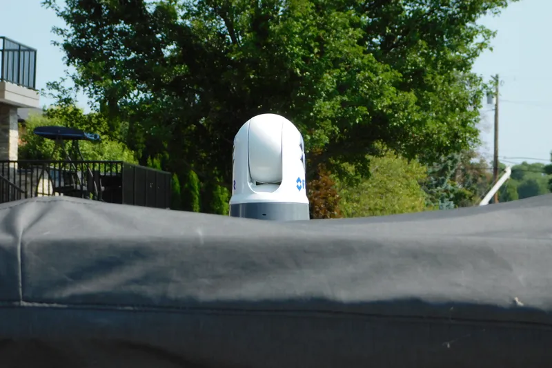 Slide: The Image of 2017 Sunsation 32 CCX boat with covered deck, surrounded by greenery. - 42