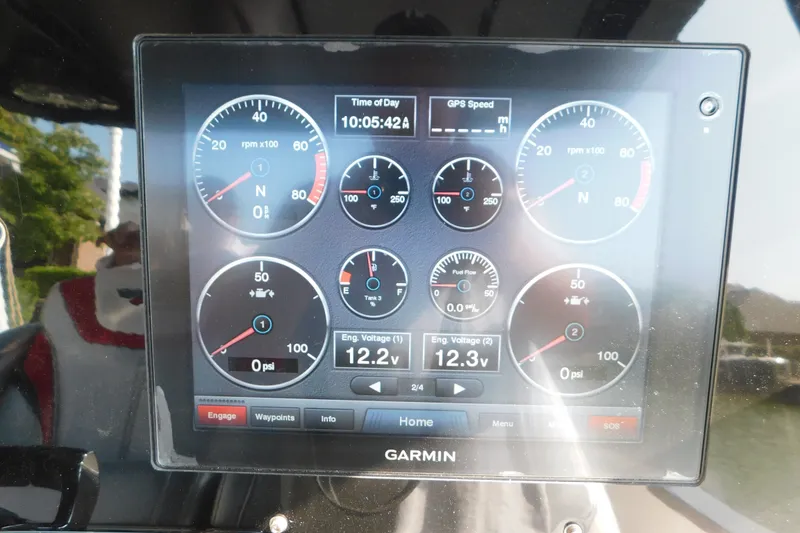 Slide: The Image of Garmin display on 2017 Sunsation 32 CCX showing engine metrics and GPS speed. - 31