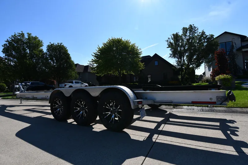 Slide: The Image of Trailer for 2017 Sunsation 32 CCX boat parked on suburban street. - 37