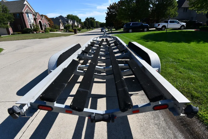 Slide: The Image of Boat trailer for 2017 Sunsation 32 CCX on suburban street. - 38