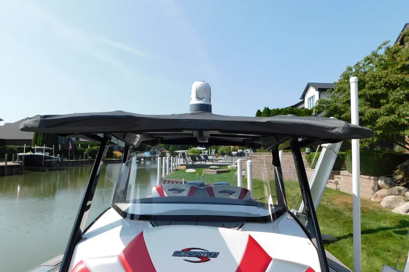 Slide: The Image of 2017 Sunsation 32 CCX boat docked in a scenic canal setting. - 25