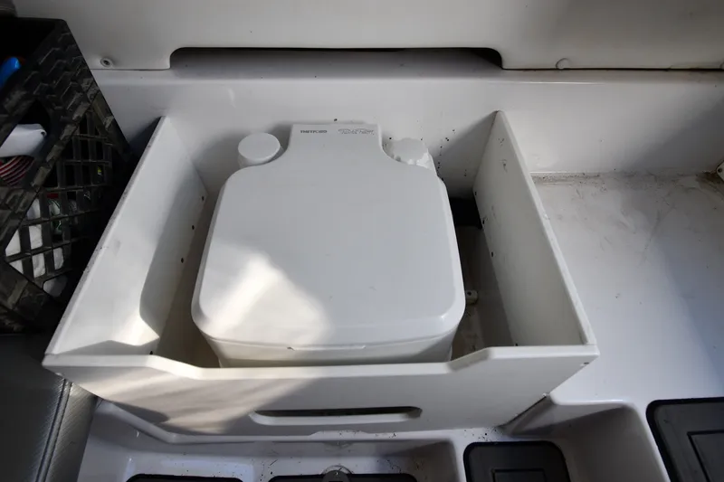 Slide: The Image of Portable toilet in 2017 Sunsation 32 CCX boat interior compartment. - 35