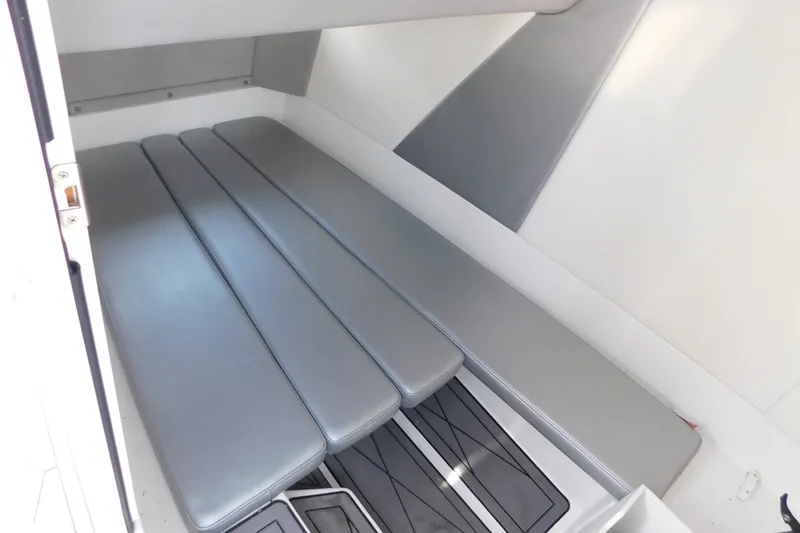 Slide: The Image of 2017 Sunsation 32 CCX cabin interior with gray cushioned seating. - 44