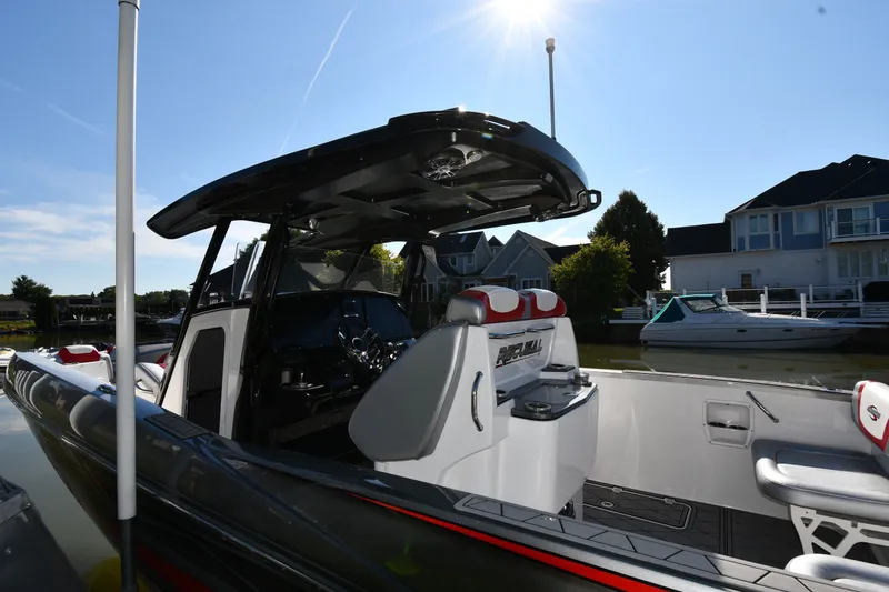 Slide: The Image of 2017 Sunsation 32 CCX boat docked, featuring sleek design and modern interior. - 3