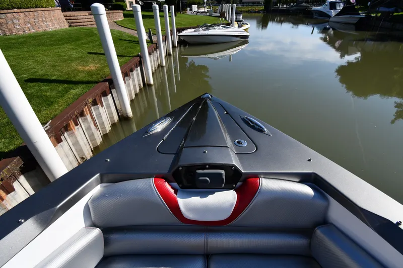 Slide: The Image of Bow view of 2017 Sunsation 32 CCX boat docked in a calm marina. - 6