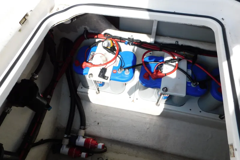 Slide: The Image of 2017 Sunsation 32 CCX boat battery compartment with wiring and connections. - 49