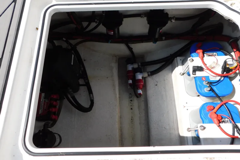 Slide: The Image of 2017 Sunsation 32 CCX boat battery compartment with wiring and connections. - 48