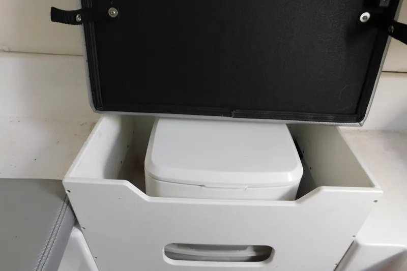 Slide: The Image of 2017 Sunsation 32 CCX boat with built-in storage compartment and portable toilet. - 47