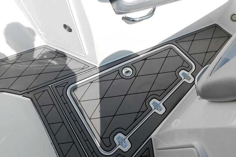 Slide: The Image of 2017 Sunsation 32 CCX boat deck with sleek, modern design and textured flooring. - 19