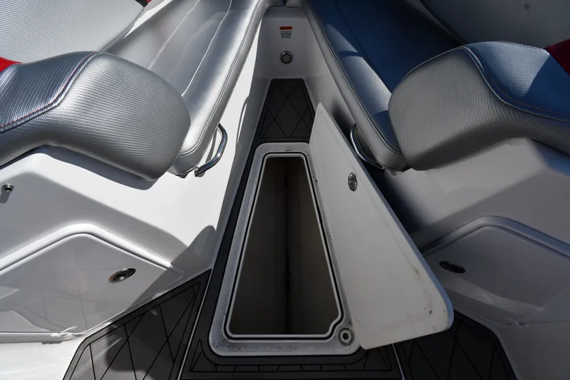Slide: The Image of 2017 Sunsation 32 CCX boat interior storage compartment with open hatch. - 24