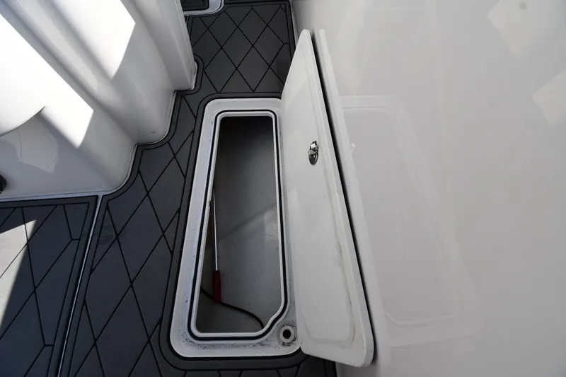 Slide: The Image of Open storage compartment on 2017 Sunsation 32 CCX boat deck. - 25