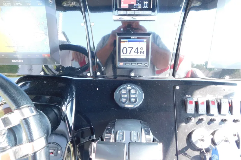Slide: The Image of Control panel of a 2017 Sunsation 32 CCX boat with Garmin navigation displays. - 32